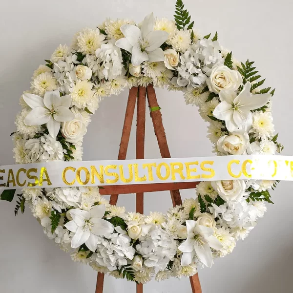 Corona Fúnebre sencilla con rosas luto para funerales en Bogotá.