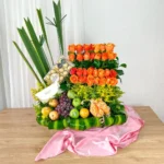 Arreglos florales sencillos rosas naranjas degradé frutas chocolates Ferrero Rocher